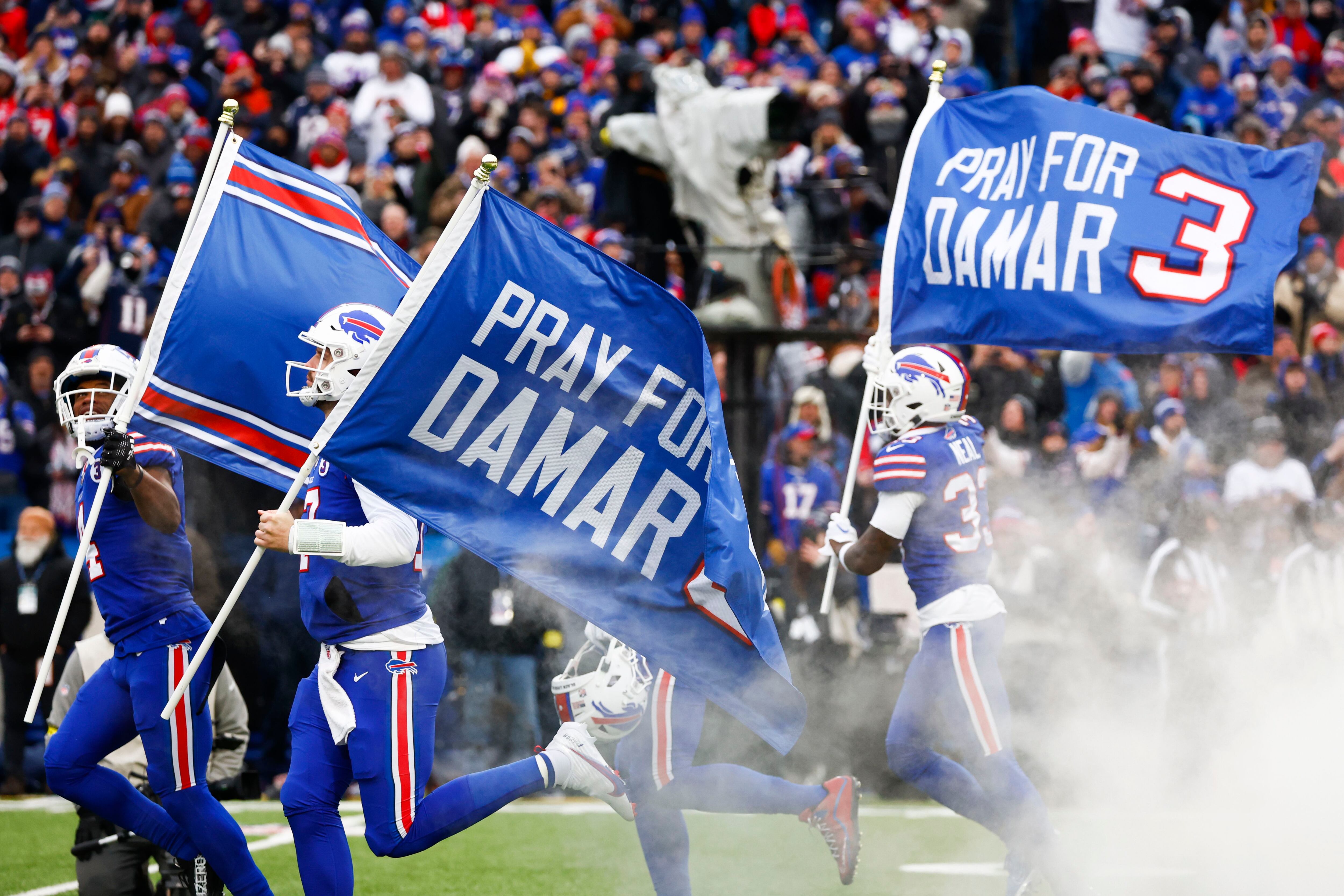 Buffalo Bills safety Damar Hamlin is visited by Rodney Thomas II