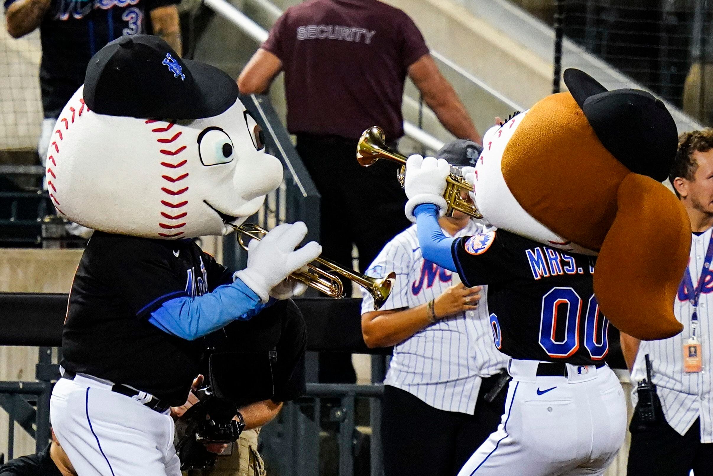 New York Mets mascots Mr. & Mrs. Met during the seventh inning