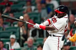 ATLANTA, GA - JULY 04: Rookie Atlanta Braves center fielder Michael Harris  II (23) bats during the Monday evening MLB game between the Atlanta Braves  and the St. Louis Cardinals on July