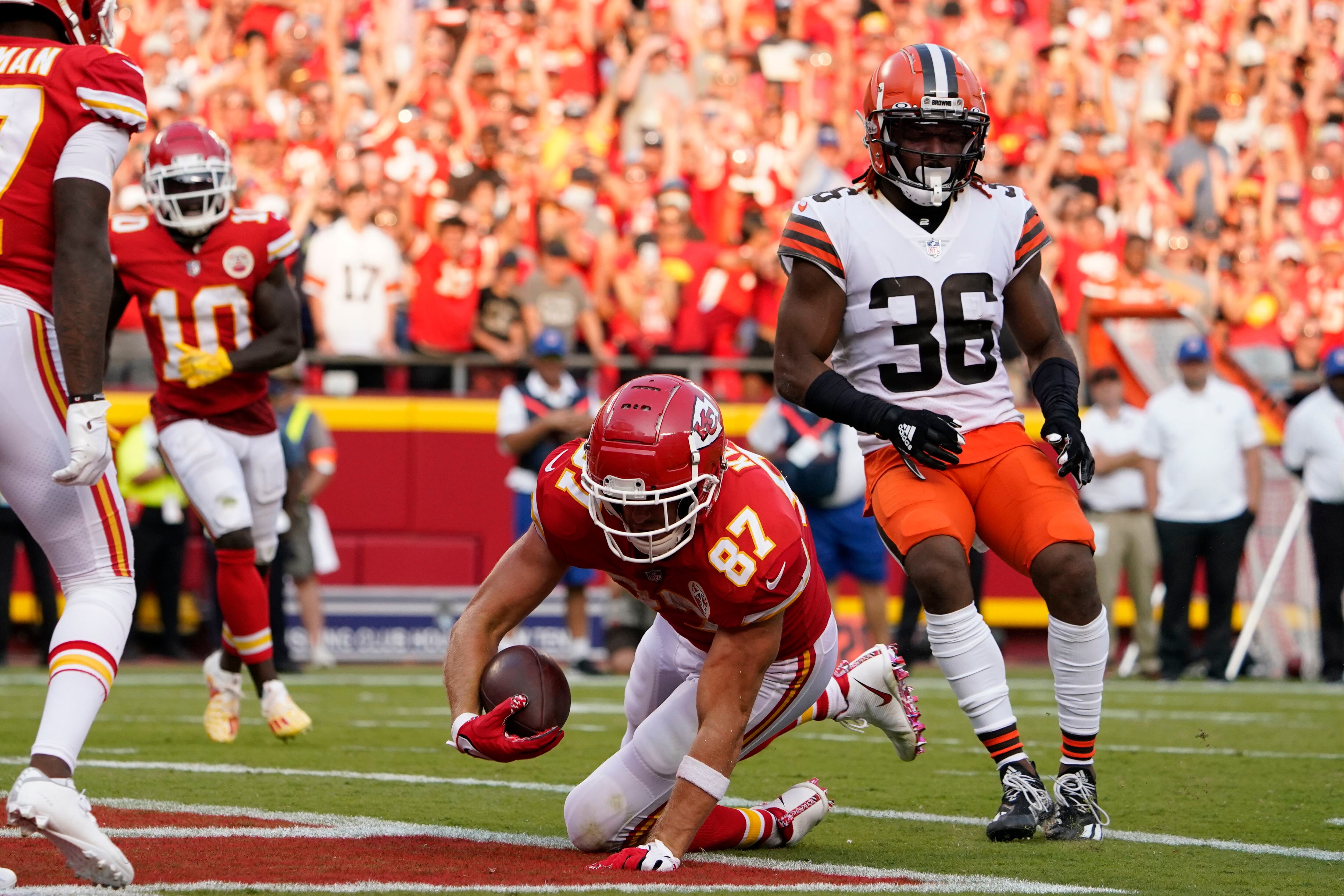 Kansas City Chiefs quarterback Patrick Mahomes (15) celebrates with tight  end Travis Kelce (87) after throwing a 67-yard touchdown pass to Tyreek  Hill during the first quarter of an NFL football game