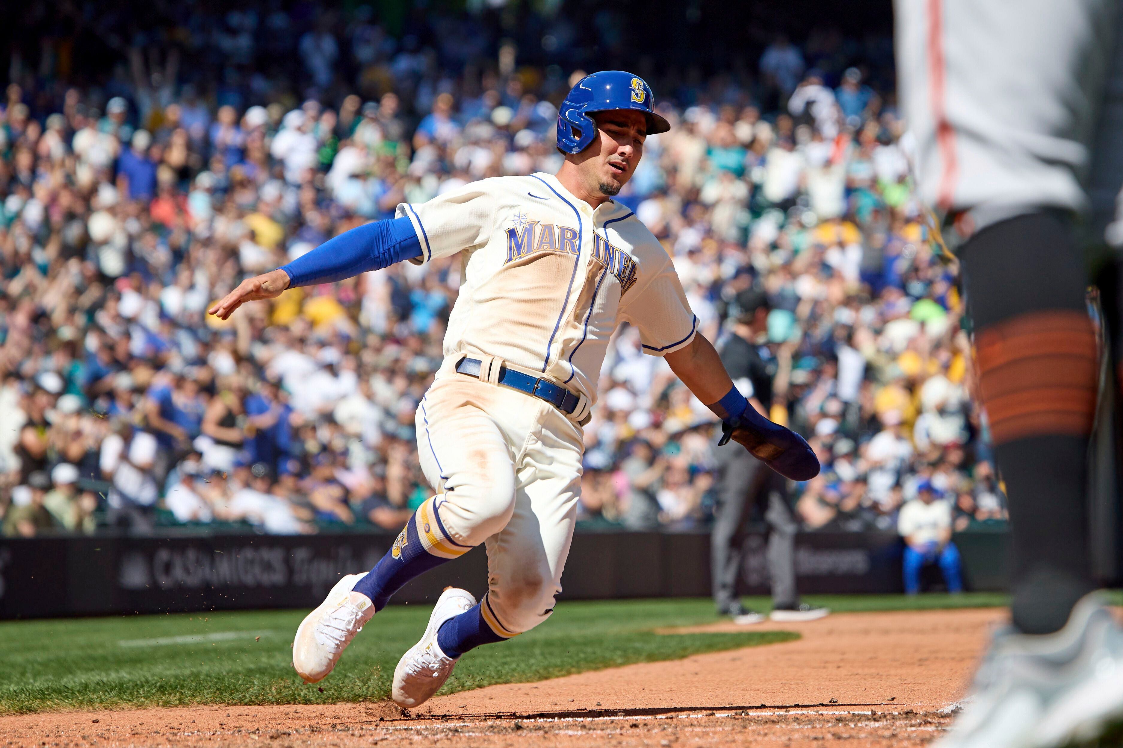 PHOTOS: Seattle Mariners Catcher Cal Raleigh Raises The 12 Flag