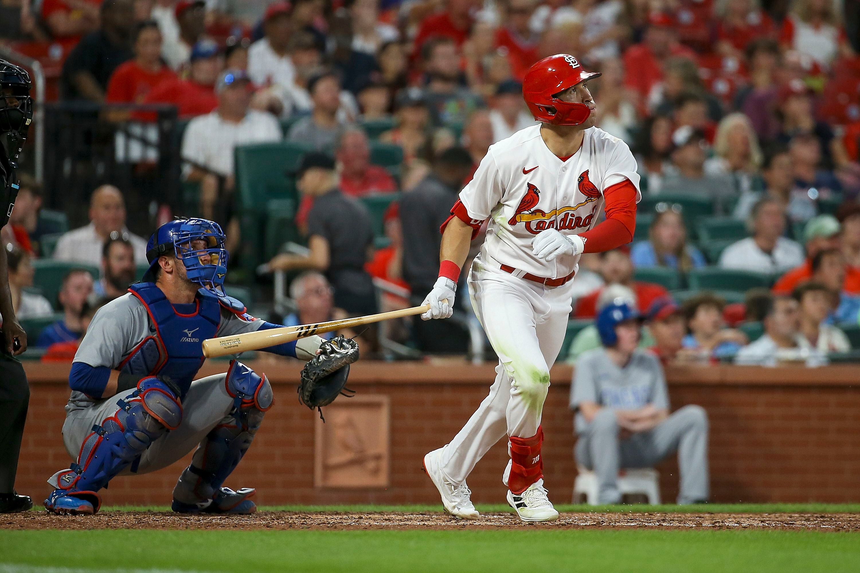 St. Louis Cardinals catcher Yadier Molina walks back to position after a  mound visit with starting pitcher Adam Wainwright in the seventh inning  against the San Francisco Giants at Busch Stadium in