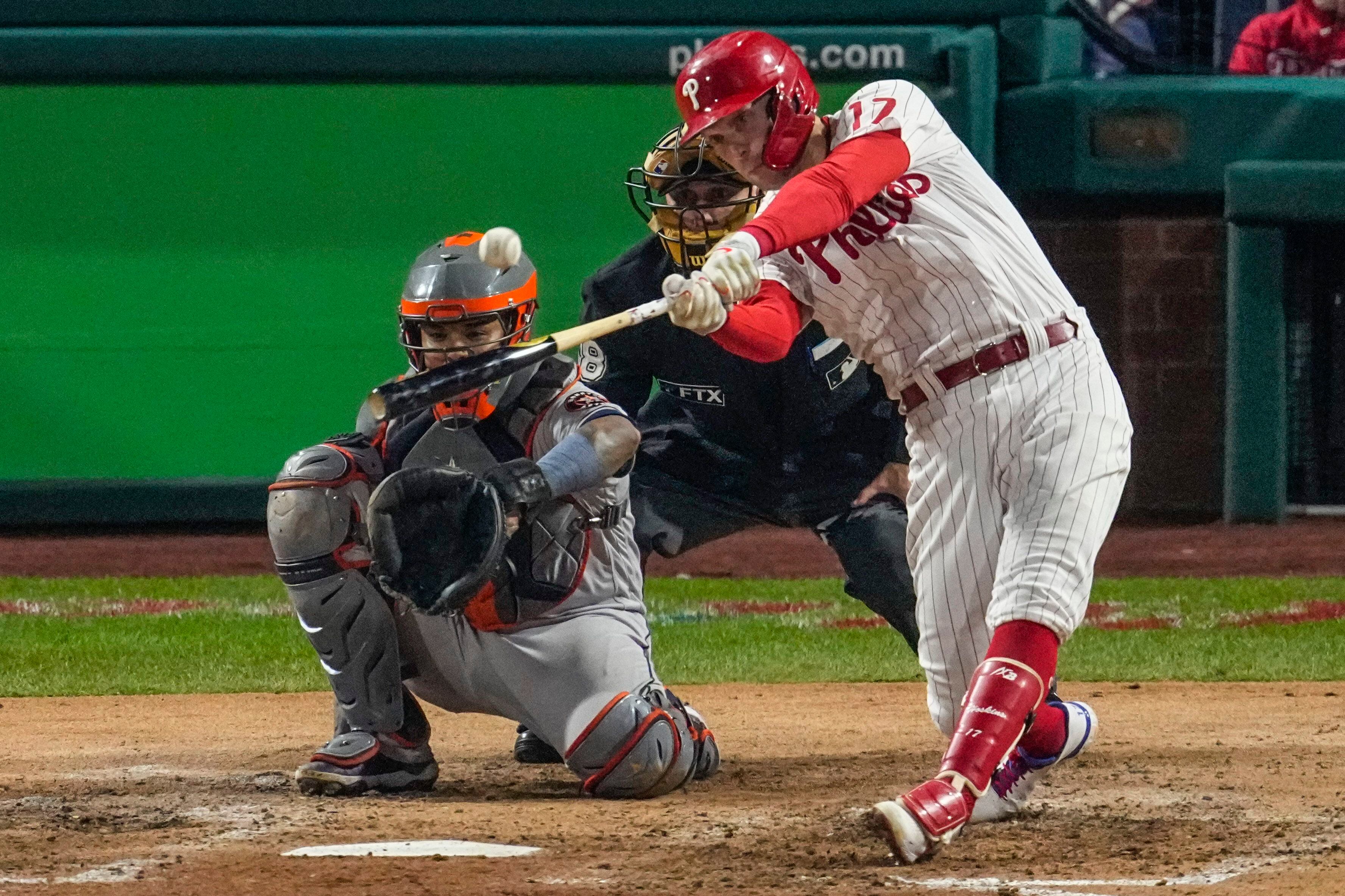 Rhys Hoskins of the Philadelphia Phillies blows a bubble during a in  2023