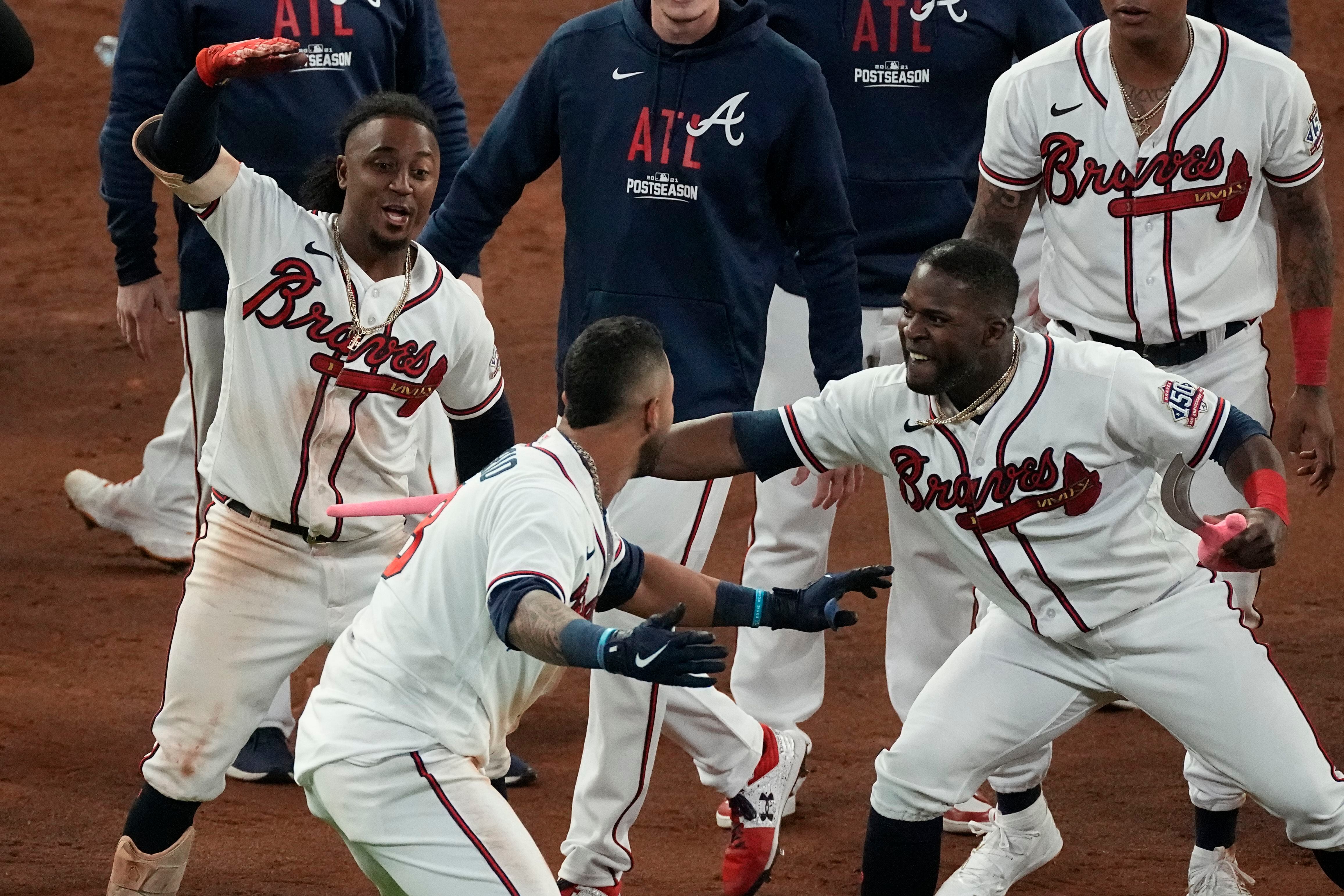 Atlanta, United States. 23rd Oct, 2021. Atlanta Braves left fielder Eddie  Rosario (R) celebrates hitting a three-run home run with teammate Ozzie  Albies (1) during the fourth inning against the Los Angeles