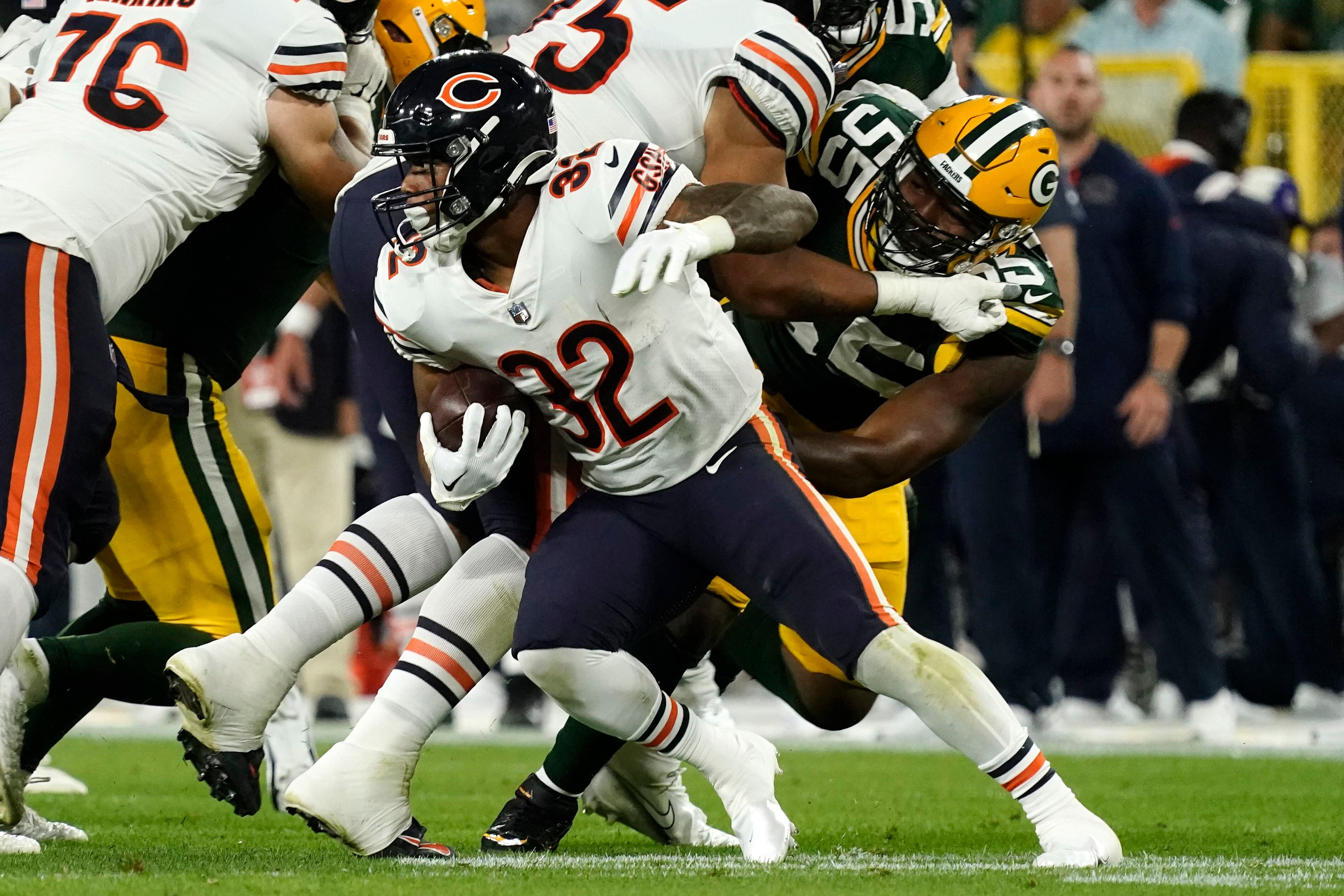 Chicago Bears defensive tackle Justin Jones (93) runs on the field before  an NFL game between the Chicago Bears and the Green Bay Packers Sunday, Sept.  18, 2022, in Green Bay, Wis. (