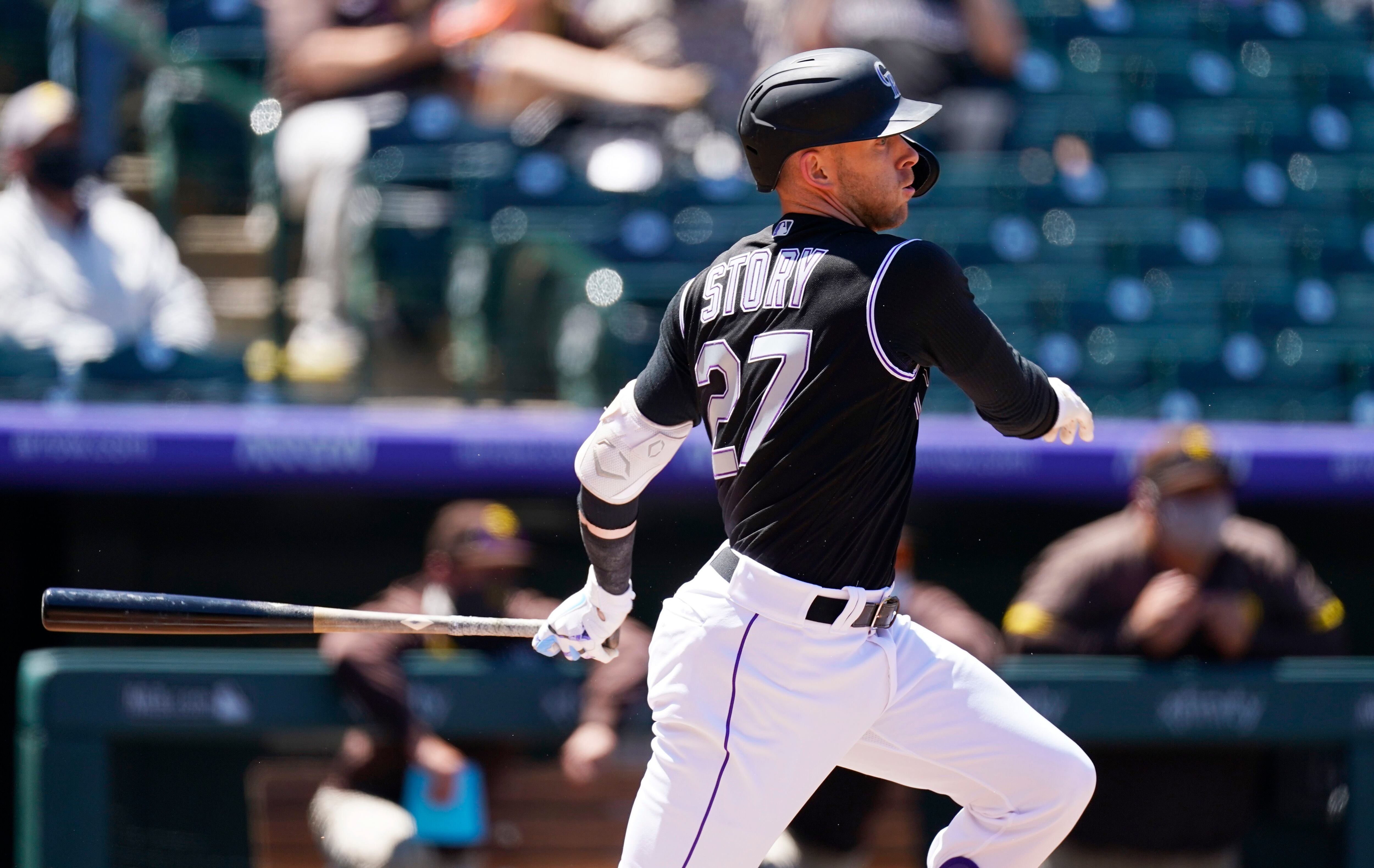 San Diego Padres' Victor Caratini heads up the first-base line after  connecting for a grand slam off Colorado Rockies relief pitcher Robert  Stephenson in the sixth inning of game one of a