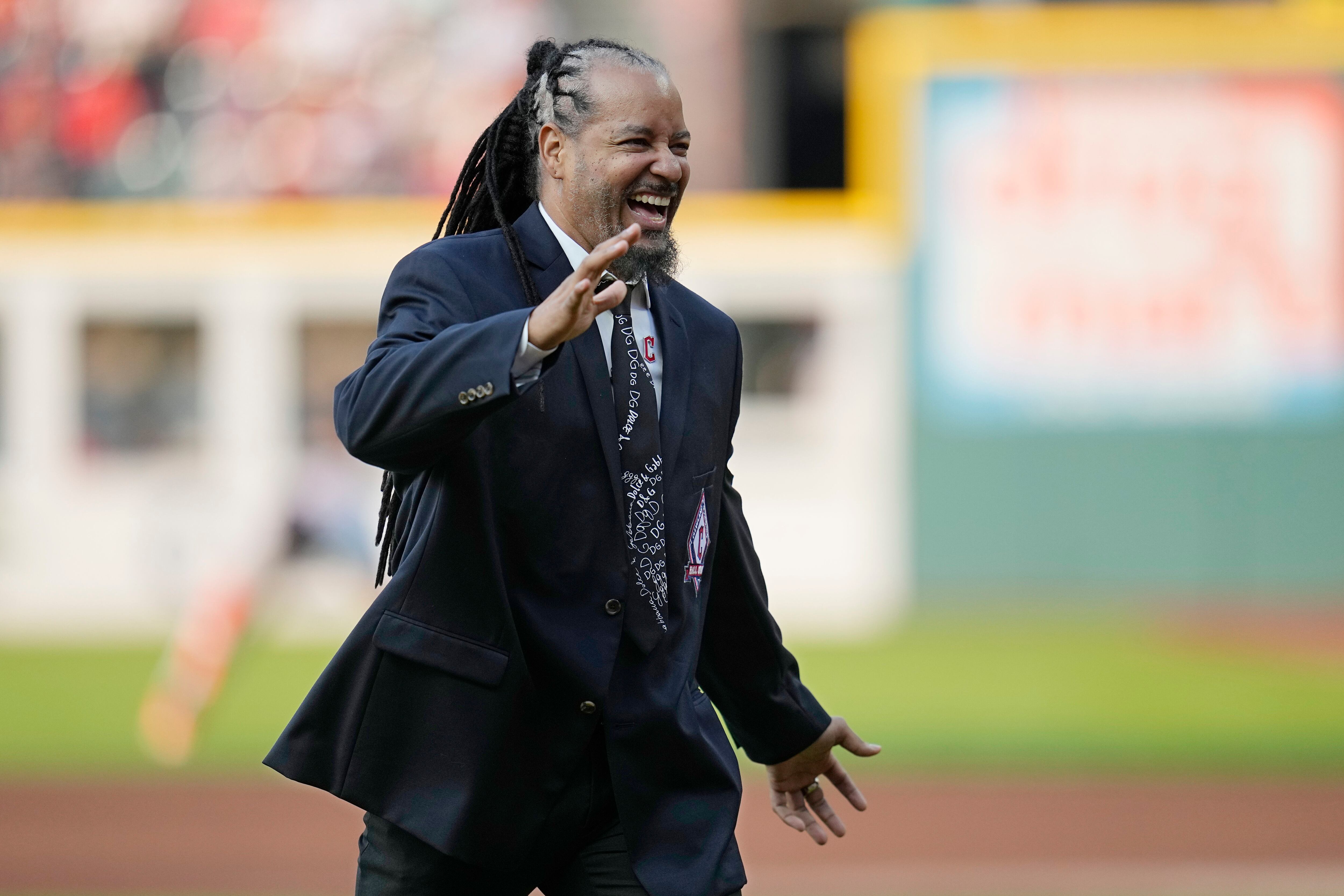 Former Cleveland baseball player Manny Ramirez watches a video