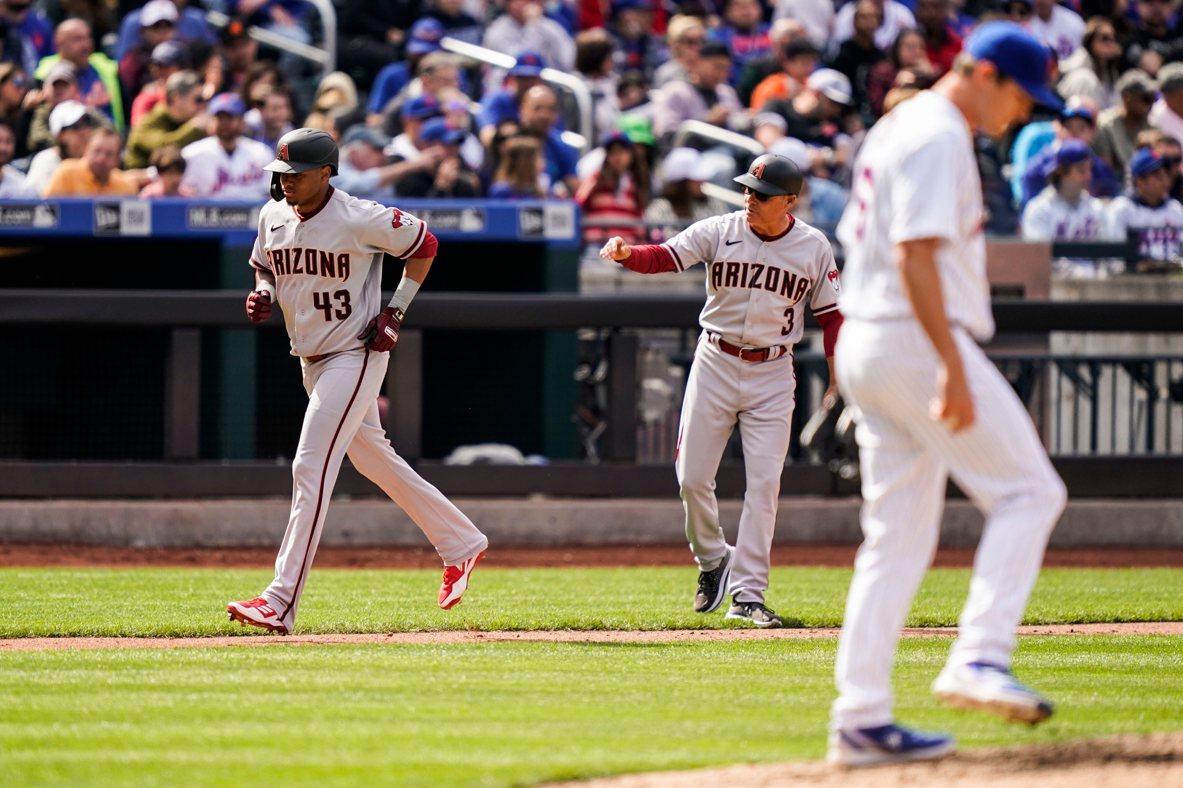 Arizona Diamondbacks left fielder David Peralta (6), second baseman Ketel  Marte (12), and center fielder Jake McCarthy (30) celebrate after closing  the ninth inning of a baseball game against the New York