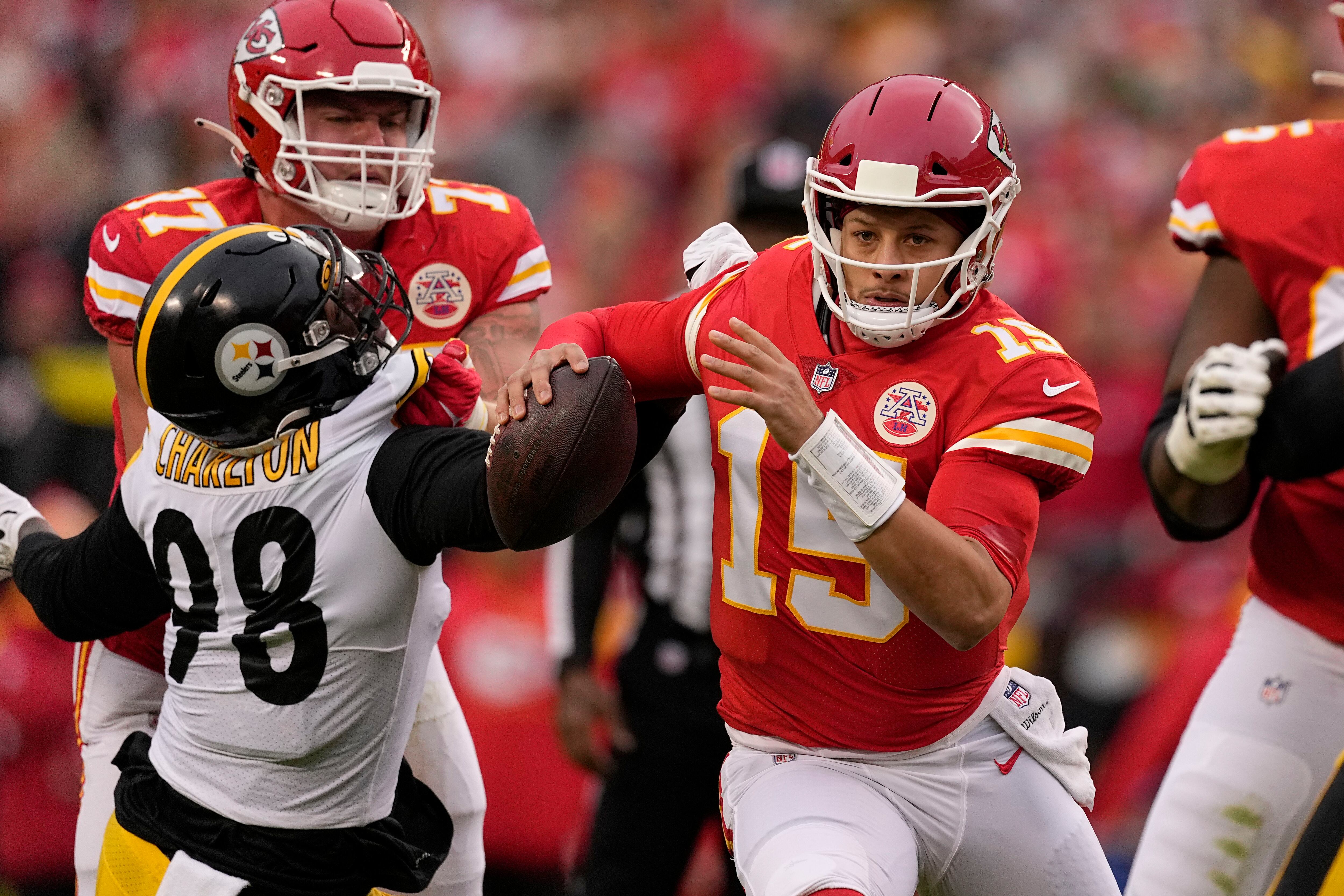 Kansas City Chiefs strong safety Tyrann Mathieu (32) follows cornerback Charvarius  Ward (35) do …