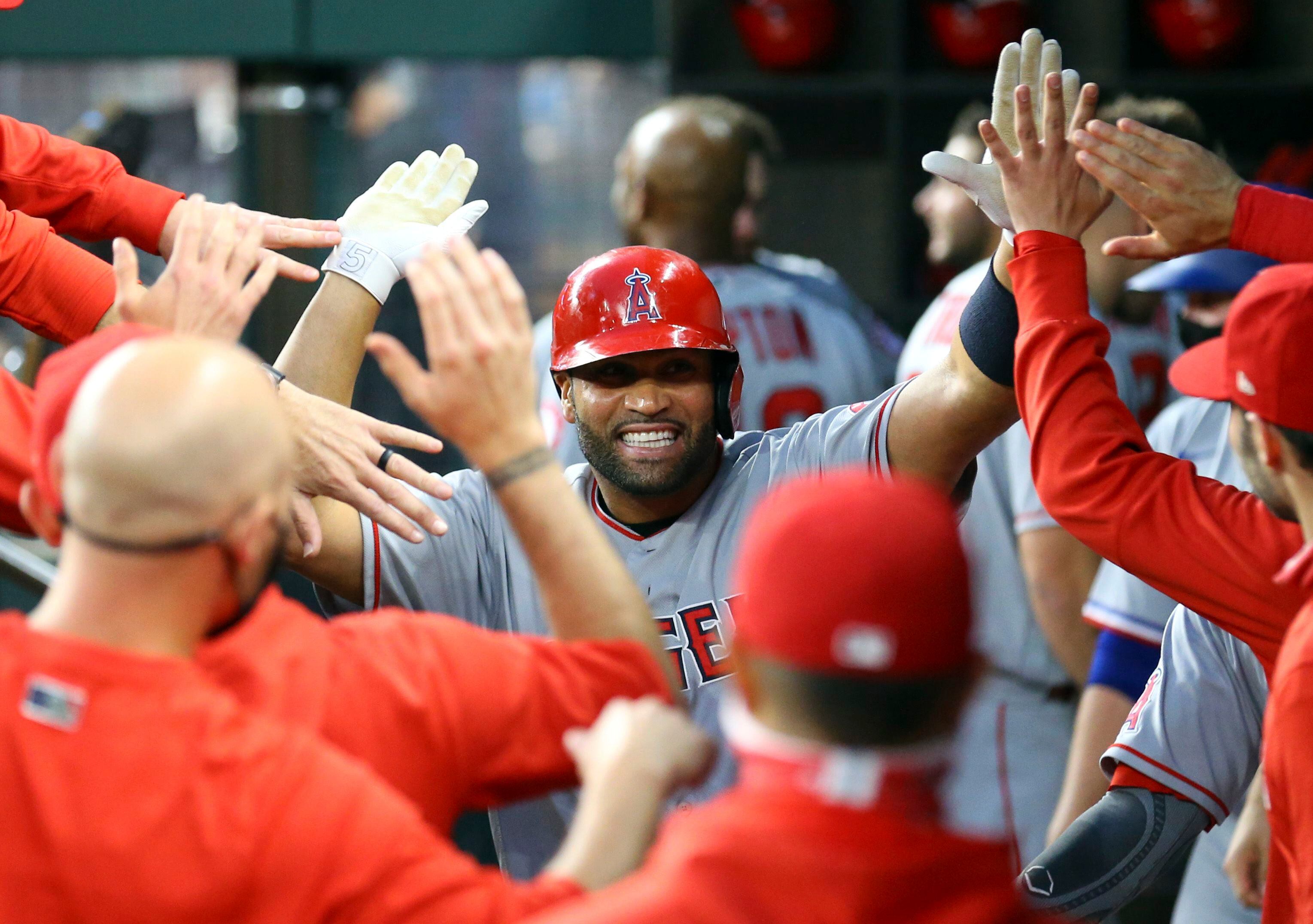 Slumping slugger Pujols cut by Angels, still wants to play