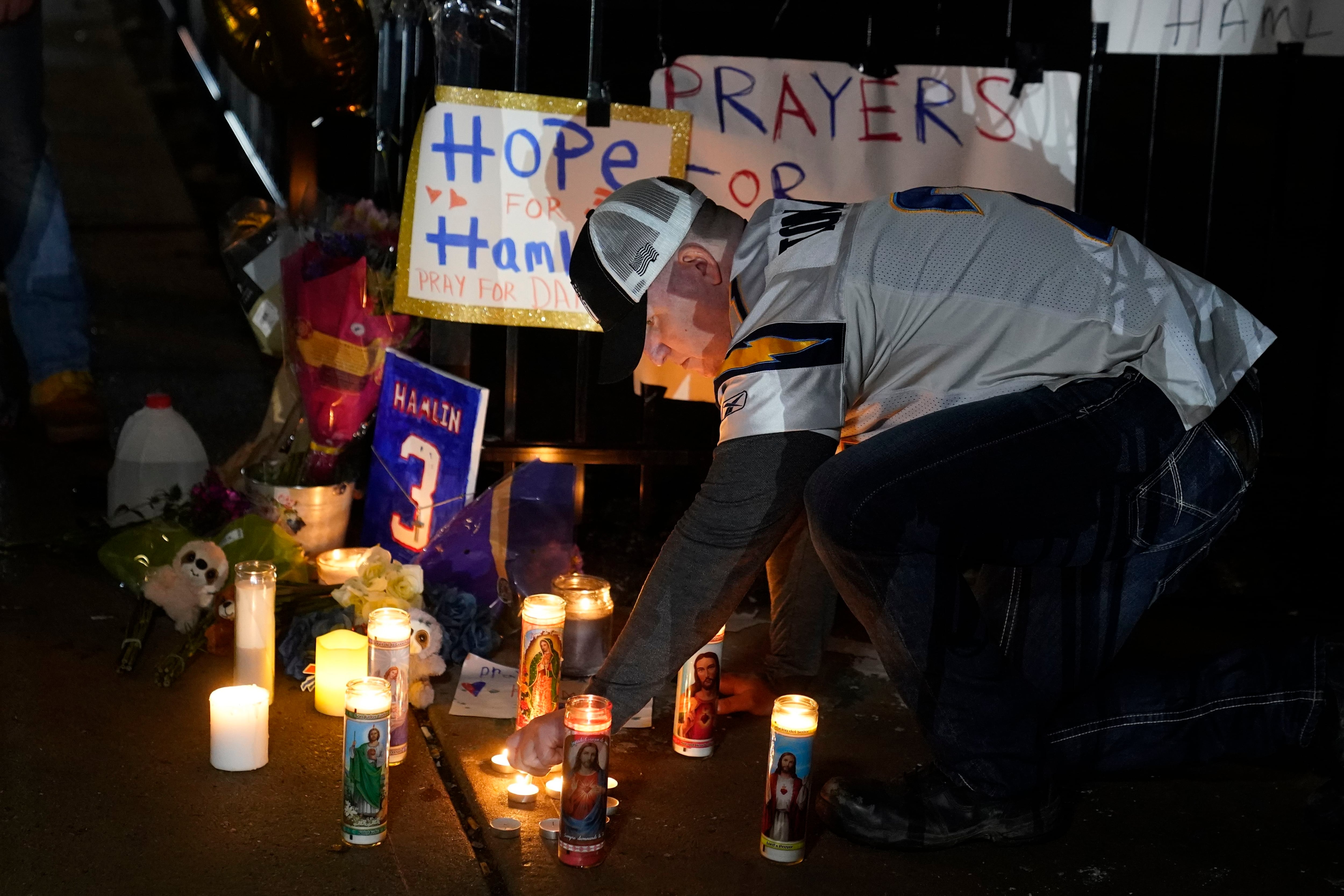 Bengals fans joined in the Lord's Prayer as Bills safety Damar Hamlin was  treated on the field