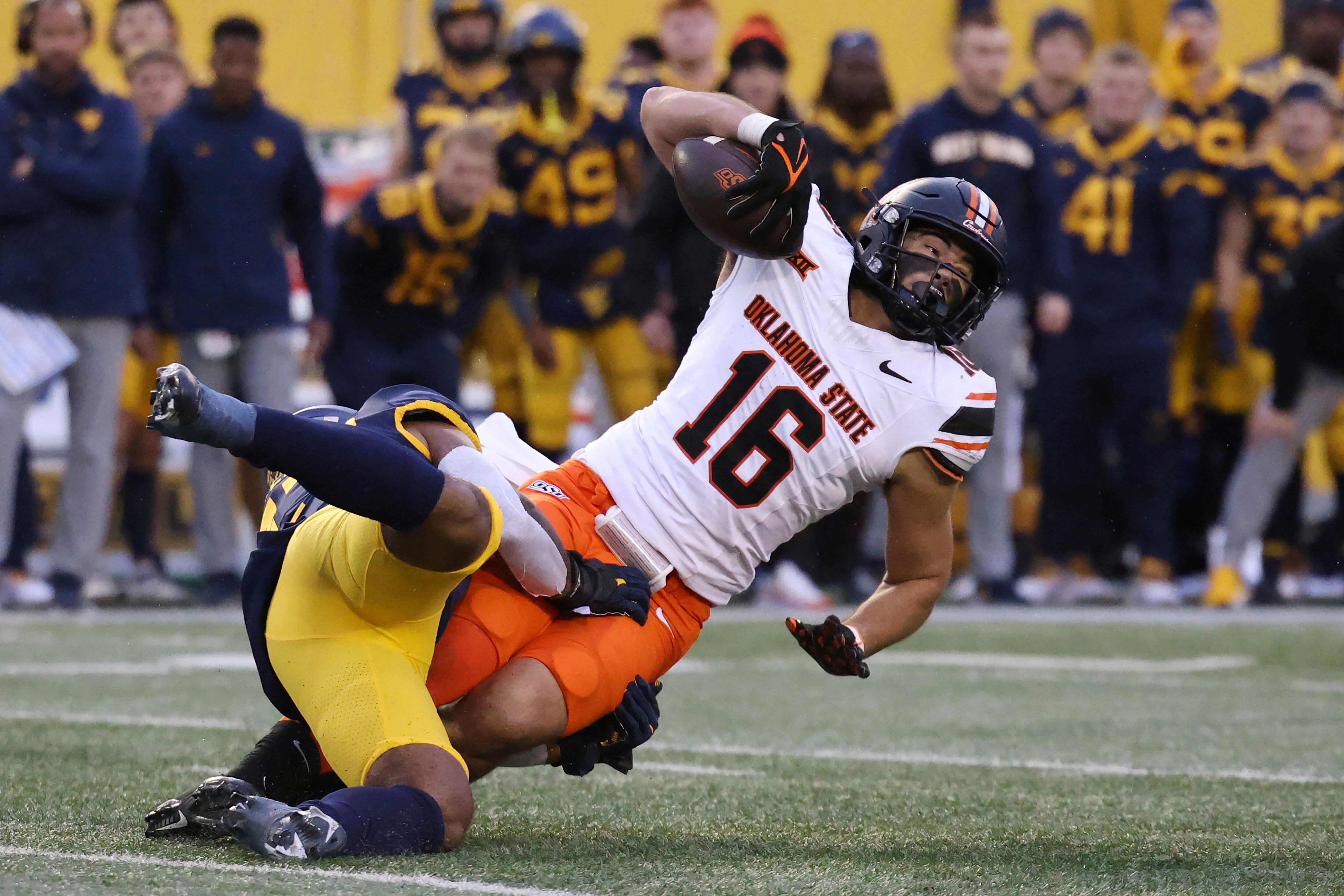 Gordon guides Oklahoma State to fifth straight win in Morgantown