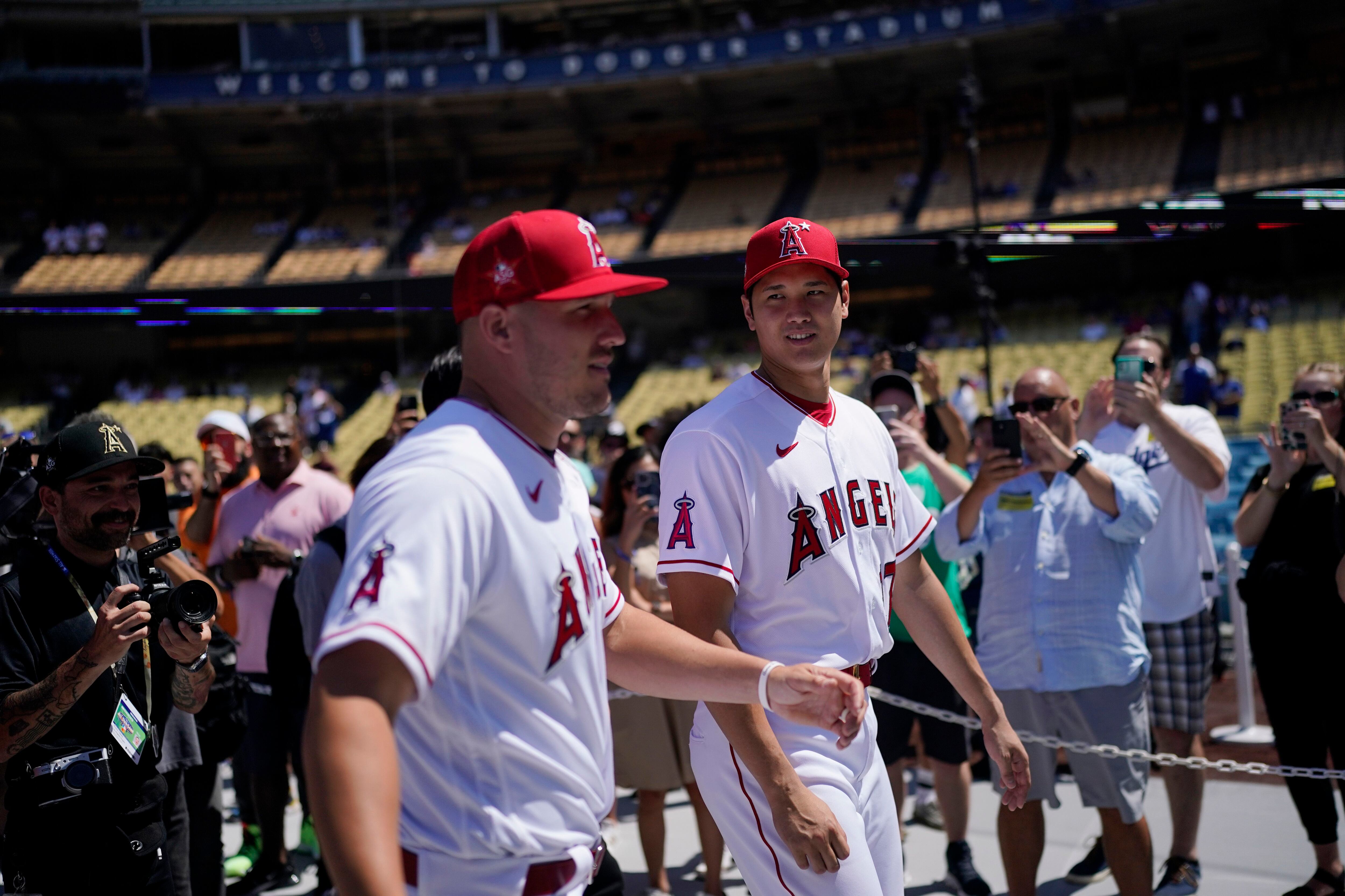 San Francisco Giants' Joc Pederson wears a promotional jersey being given  to fans as part of the team's Pride Day before a baseball game against the  Chicago Cubs in San Francisco, Saturday