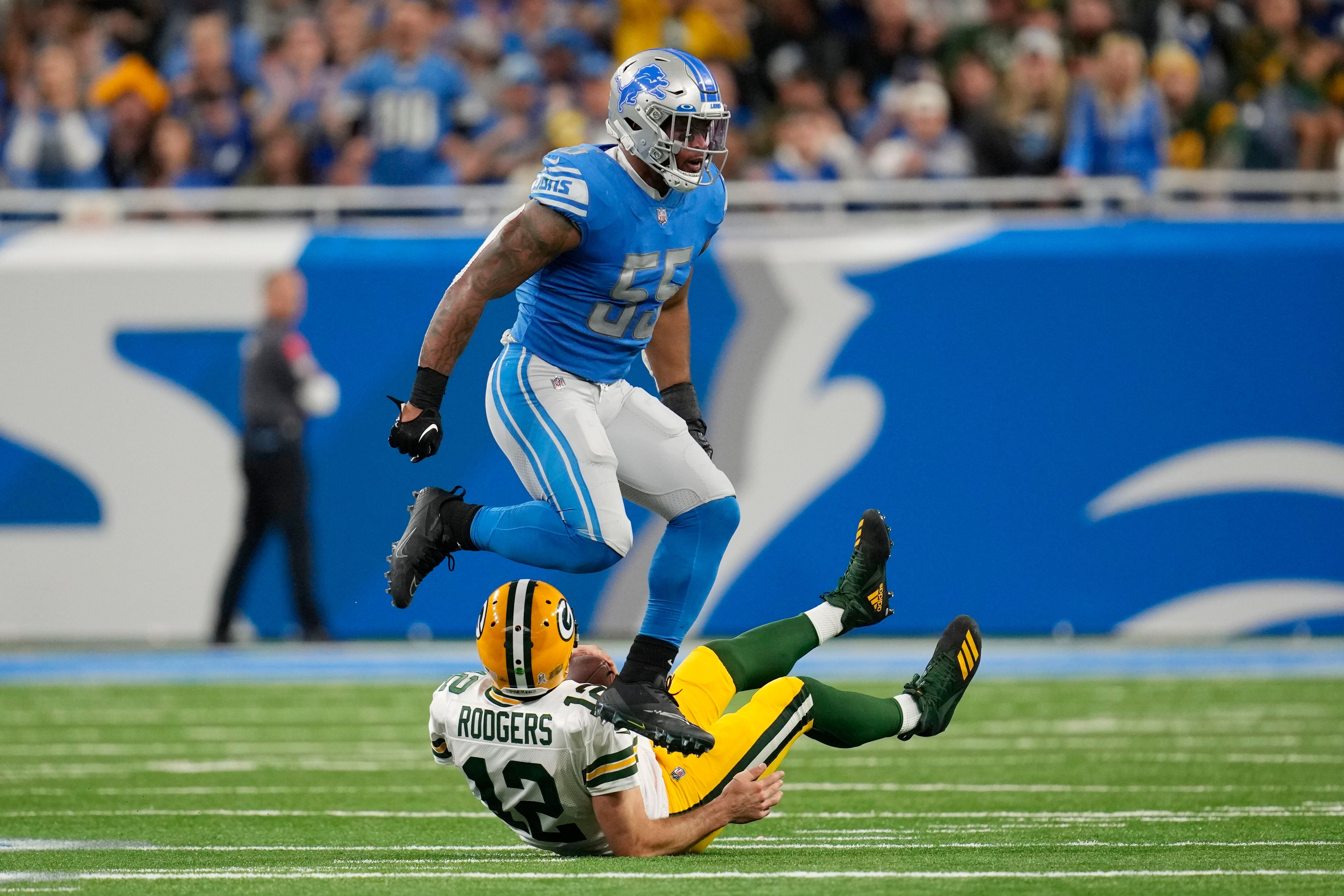 Green Bay Packers Aaron Rodgers takes a knee after being sacked