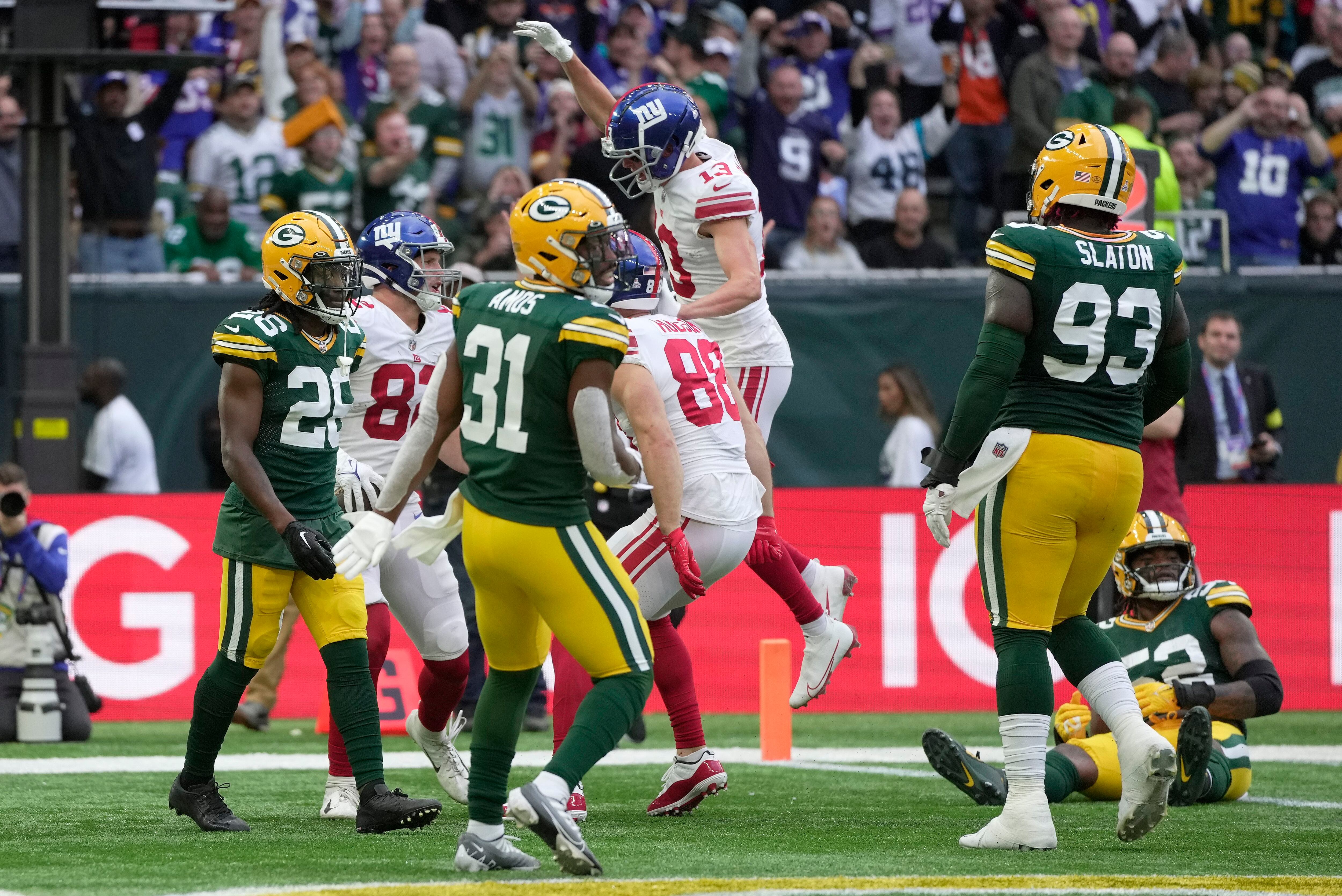 Aaron Rodgers of the Green Bay Packers is sacked by Oshane Ximines