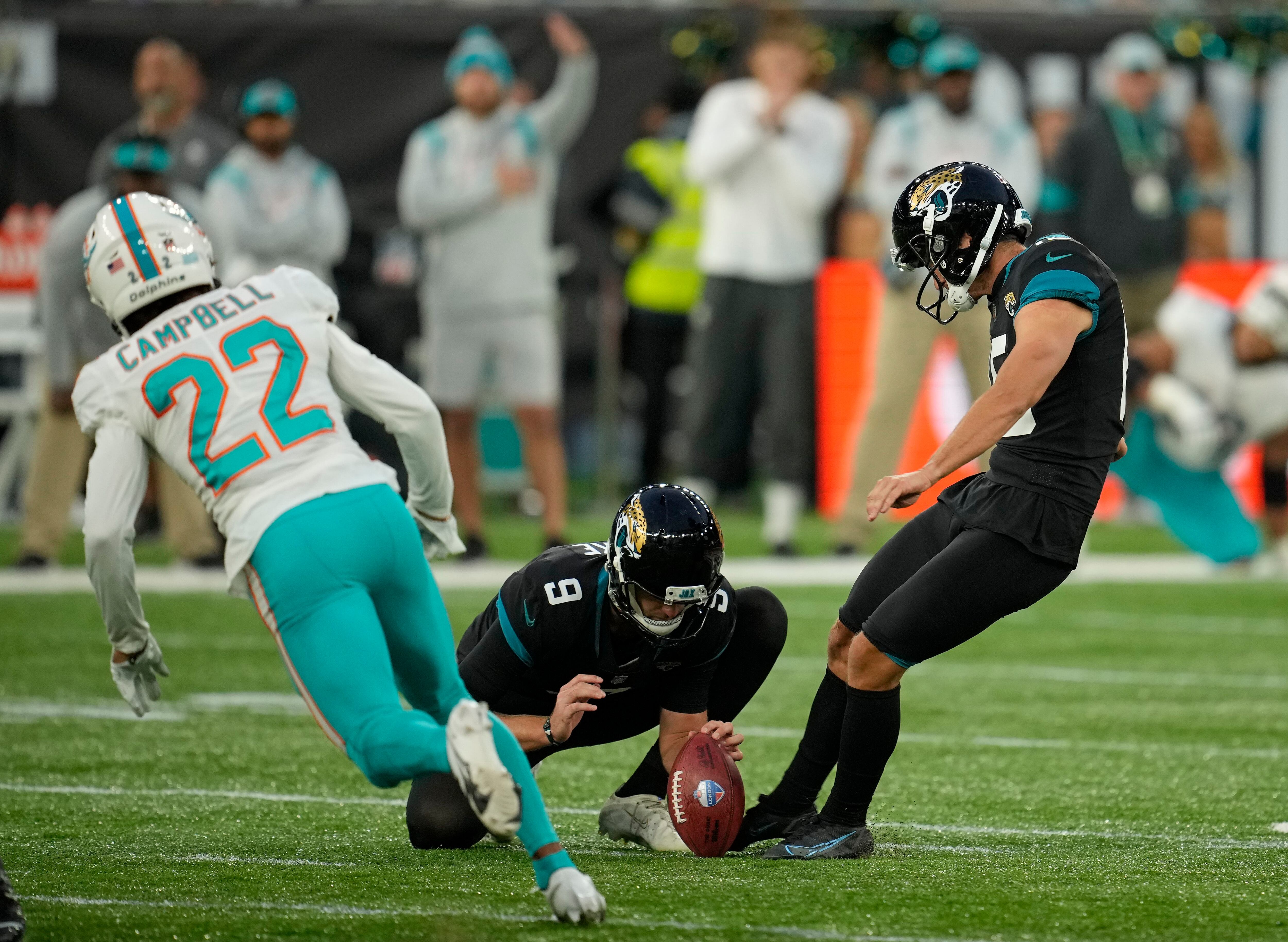 Members of the Jacksonville Jaguars defense celebrate an interception in  the end zone during the first half of an NFL football game against the  Arizona Cardinals, Sunday, Sept. 26, 2021, in Jacksonville