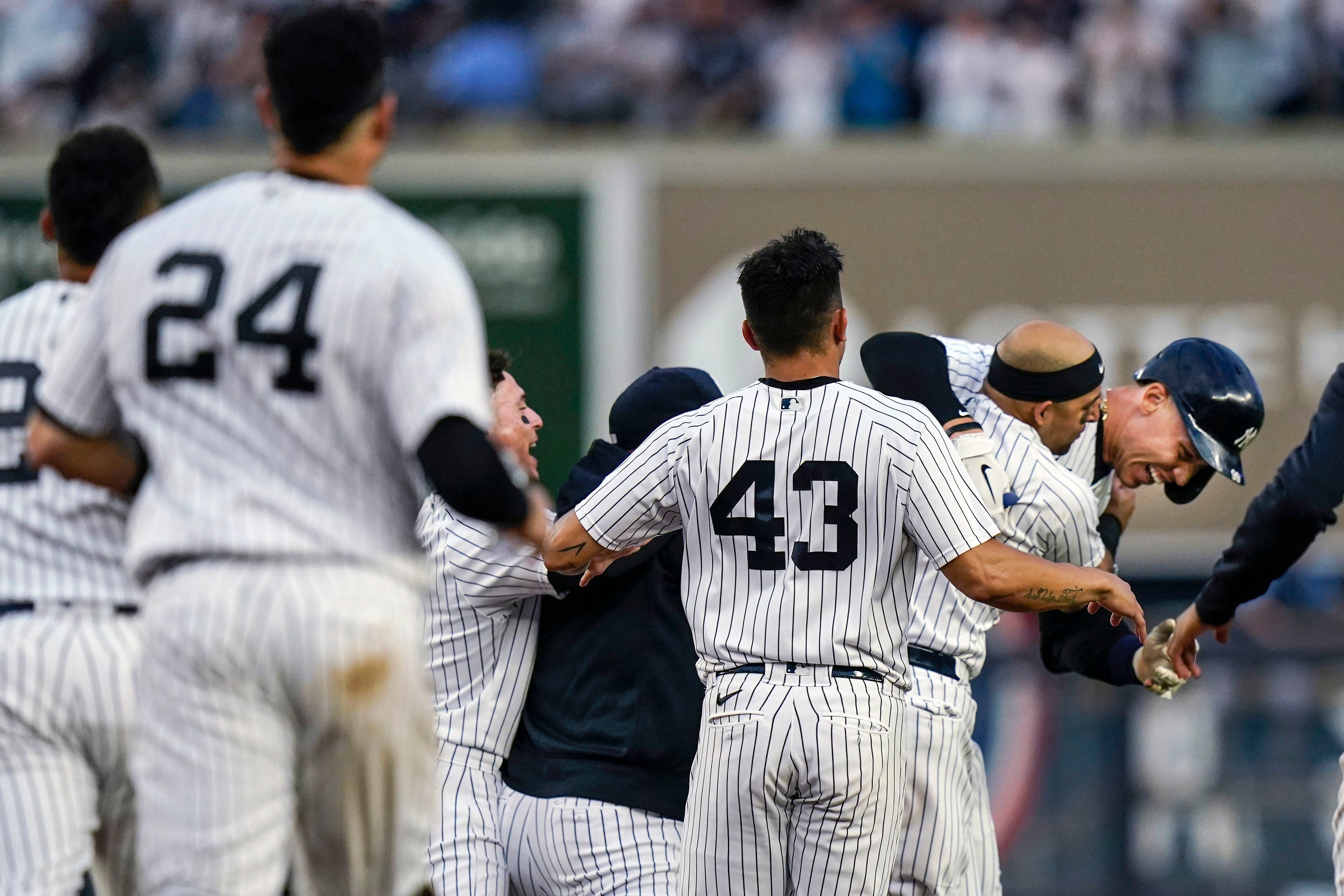 Judge delivers in 9th, Yanks clinch playoff spot in final AB