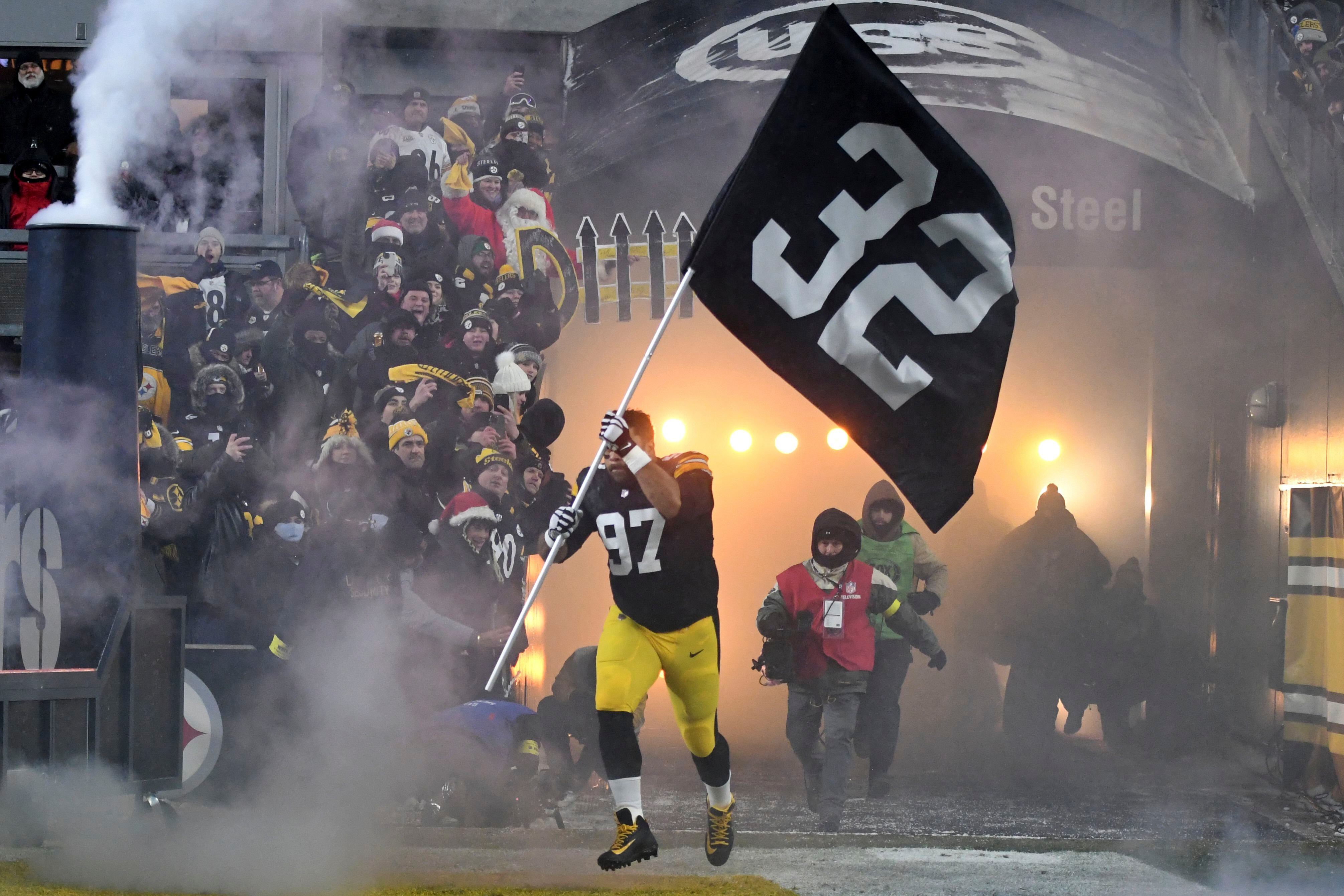 Franco Harris' widow on field in Pittsburgh as his No. 32 retired - WHYY