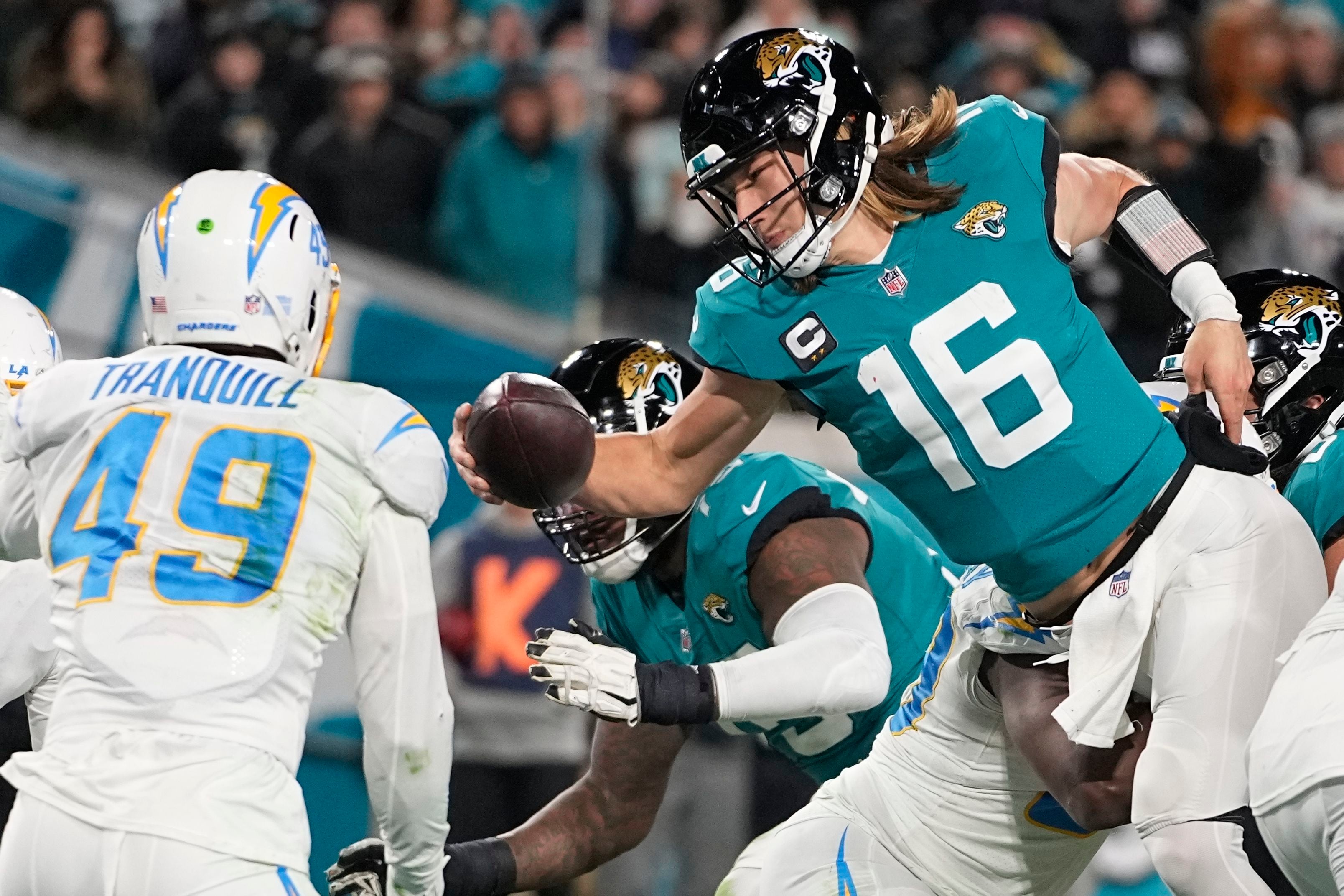 Jacksonville Jaguars quarterback Trevor Lawrence (16) warms up