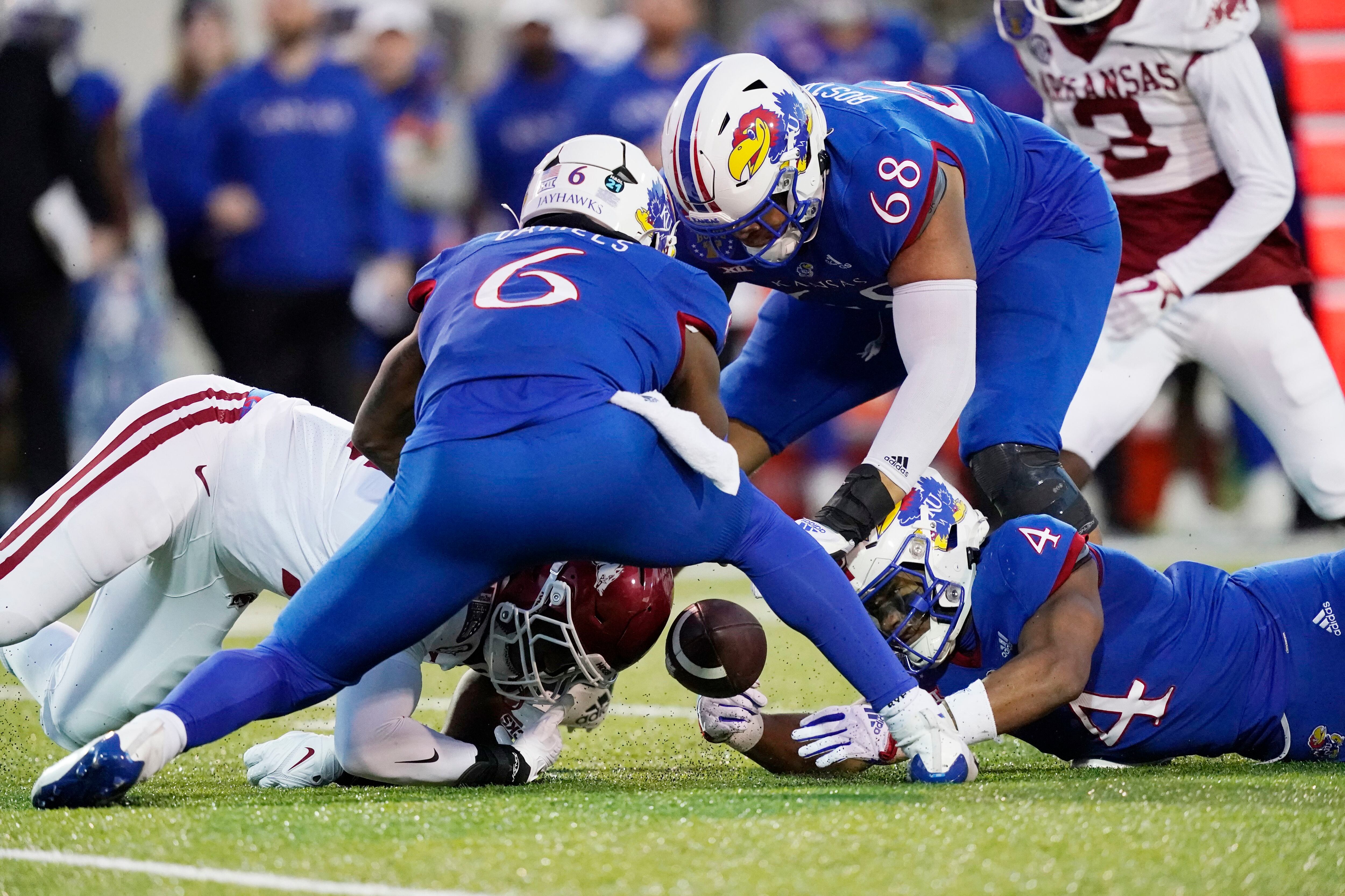 Kansas rallies, but Arkansas wins Liberty Bowl 55-53 in 3OTs