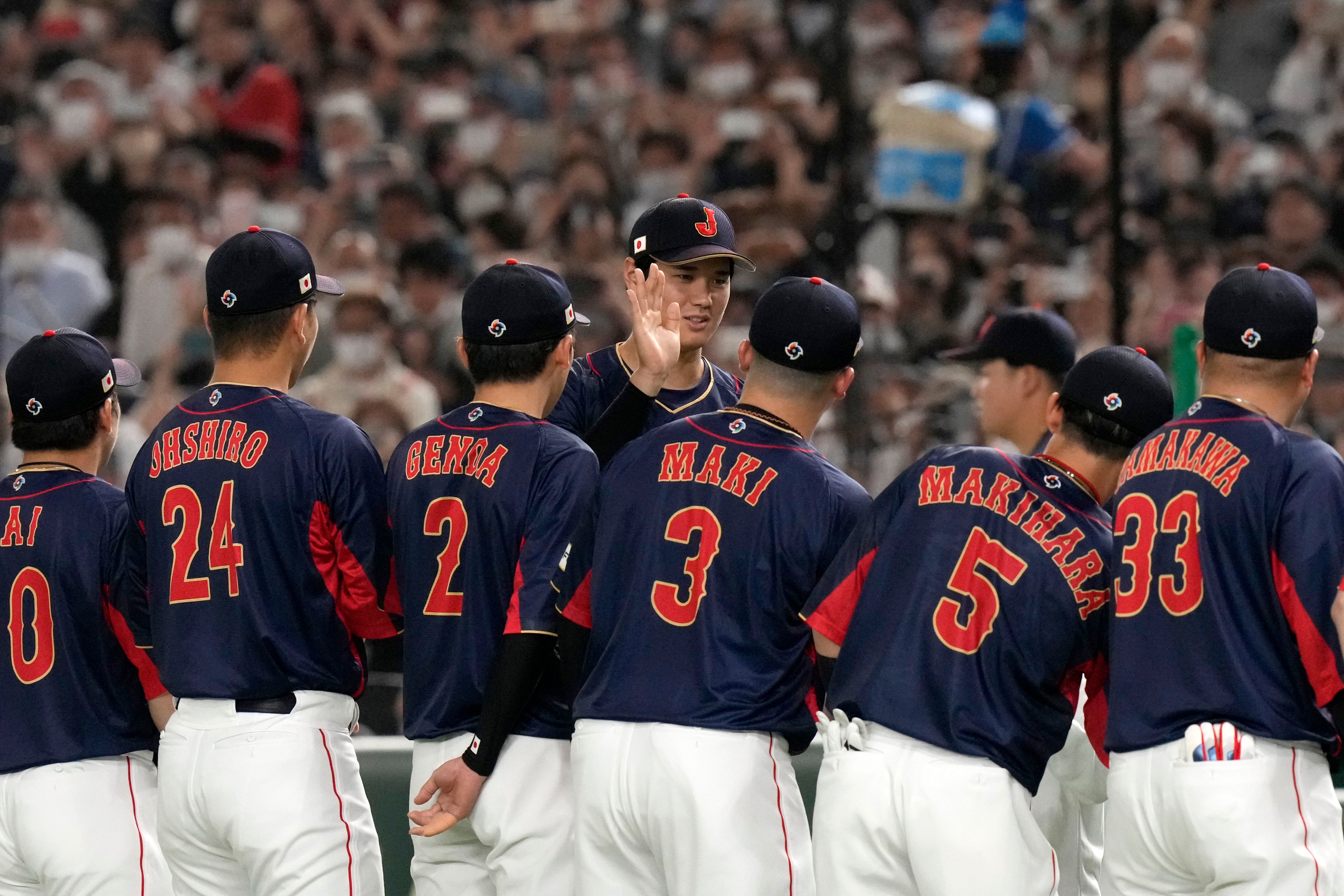 Infielder Tommy Edman and Infielder Ha-Seong Kim of Korea talk