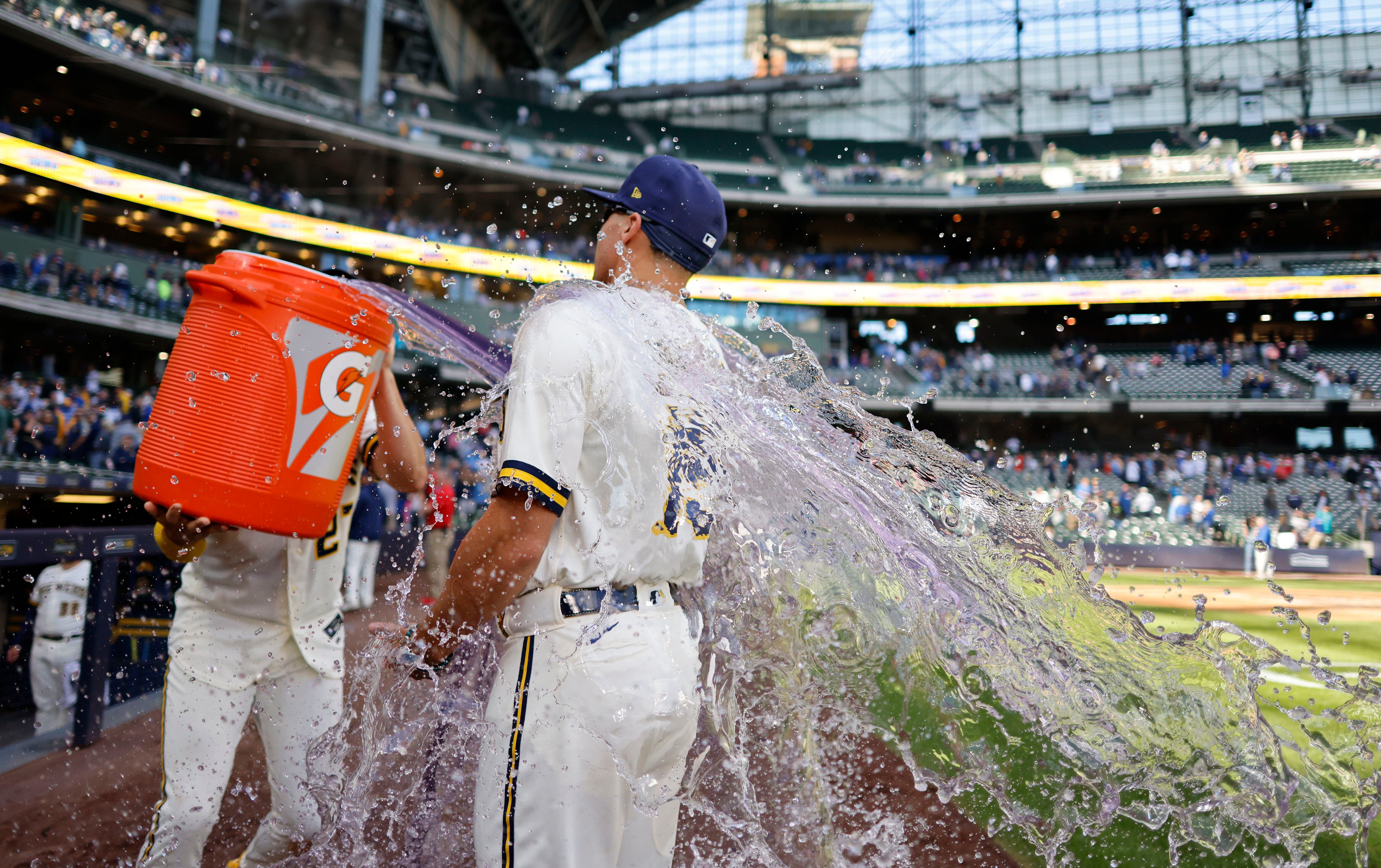 Milwaukee Brewers' Tyrone Taylor watches his three-run double off