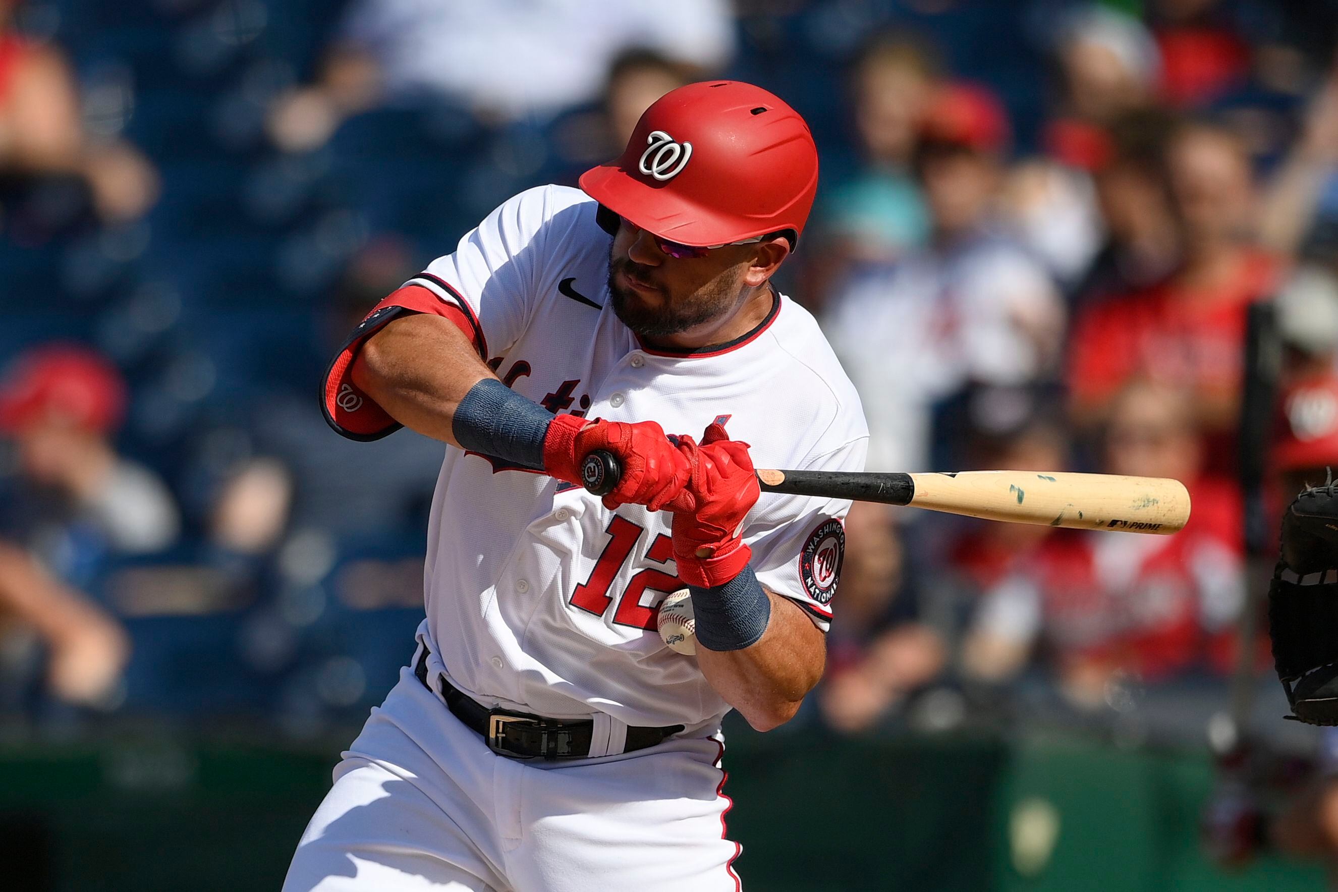 Washington Nationals shortstop Trea Turner slides into third on a