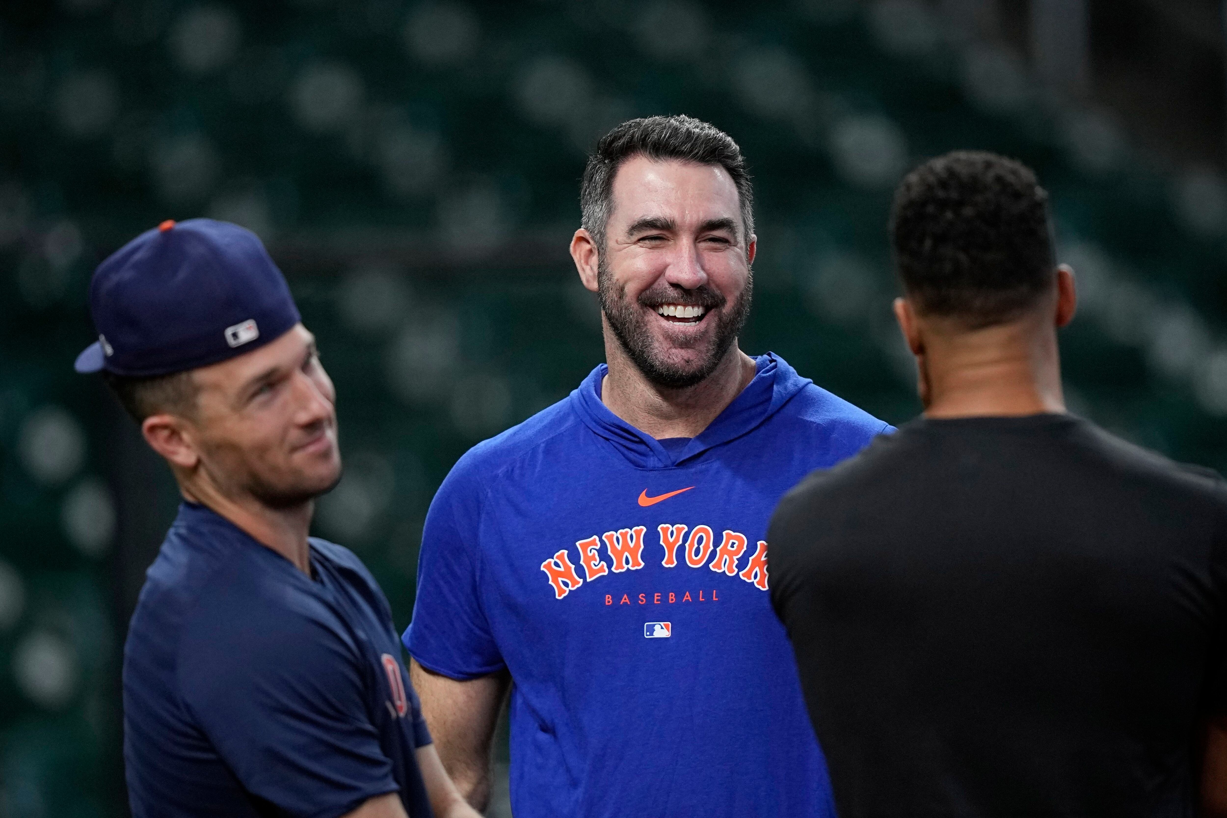 Houston Astros manager Dusty Baker Jr., right, presents New York Mets  pitcher Justin Verlander his 2022 World Series Championship ring before a  baseball game Monday, June 19, 2023, in Houston. (AP Photo/David